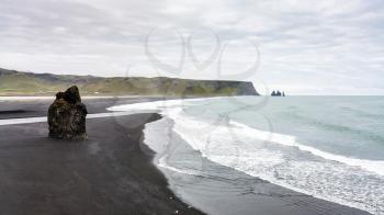 travel to Iceland - above view of volcanic stone on Kirkjufjara beach and Reynisfjara beach near Vik I Myrdal village on Atlantic South Coast in Katla Geopark in september