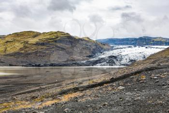 travel to Iceland - view of Solheimajokull glacier (South glacial tongue of Myrdalsjokull ice cap) in Katla Geopark on Icelandic Atlantic South Coast in autumn