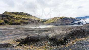 travel to Iceland - panorama of Solheimajokull glacier valley (South glacial tongue of Myrdalsjokull ice cap) in Katla Geopark on Icelandic Atlantic South Coast in september