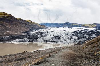 travel to Iceland - hiking path to Solheimajokull glacier (South glacial tongue of Myrdalsjokull ice cap) in Katla Geopark on Icelandic Atlantic South Coast in september