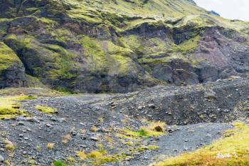 travel to Iceland - volcanic mountain slope near Solheimajokull glacier (South glacial tongue of Myrdalsjokull ice cap) in Katla Geopark on Icelandic Atlantic South Coast in september