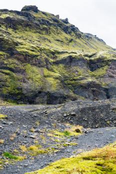 travel to Iceland - volcanic mountain near Solheimajokull glacier (South glacial tongue of Myrdalsjokull ice cap) in Katla Geopark on Icelandic Atlantic South Coast in september