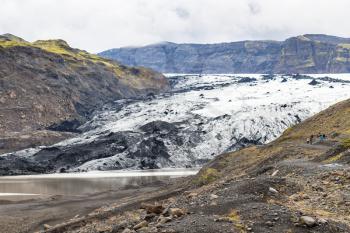 travel to Iceland - view of Solheimajokull glacier (South glacial tongue of Myrdalsjokull ice cap) in Katla Geopark on Icelandic Atlantic South Coast in september