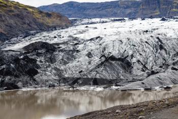 travel to Iceland - Solheimajokull glacier (South glacial tongue of Myrdalsjokull ice cap) in Katla Geopark on Icelandic Atlantic South Coast in september