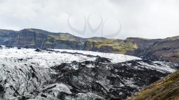 travel to Iceland - surface of Solheimajokull glacier (South glacial tongue of Myrdalsjokull ice cap) in Katla Geopark on Icelandic Atlantic South Coast in september