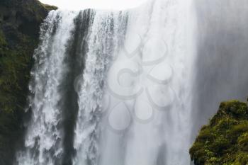 travel to Iceland - water jets of Skogafoss waterfall in Katla Geopark on Icelandic Atlantic South Coast in september