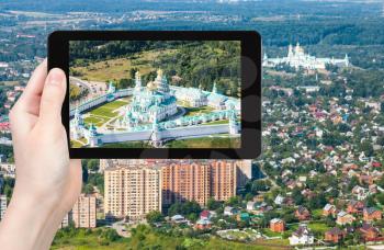 travel concept - tourist photographs of New Jerusalem (Novoiyerusalimsky, Voskresensky Resurrection) Monastery in Moscow Region in summer in Russia on tablet