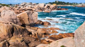 travel to France - rocky shore of English Channel in Ploumanac'h site of Perros-Guirec commune on Pink Granite Coast of Cotes-d'Armor department in the north of Brittany in sunny summer day