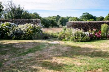 travel to France - backyard of breton country house on Atlantic coast in Ploubazlanec village of Paimpol region in Cotes-d'Armor department of Brittany in summer evening