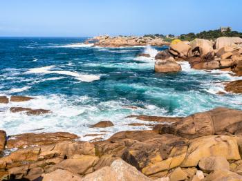 travel to France - rocky coastline of English Channel in Ploumanac'h site of Perros-Guirec commune on Pink Granite Coast of Cotes-d'Armor department in the north of Brittany in sunny summer day