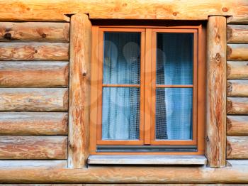 travel to Poland - wall with window of modern wooden log house in village