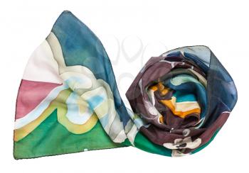 rolled hand painted batik silk scarf with abstract floral ornament isolated on white background