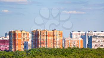 panoramic view of residential district and green trees in sunny summer day