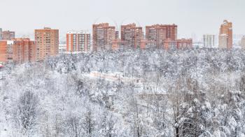 cityscape with urban Timiryazevskiy park and residential houses in Moscow city in winter evening