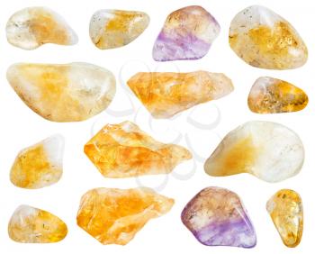 collection of various Citrine (yellow quartz) gemstones isolated on white background