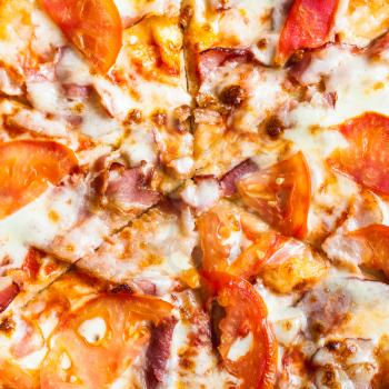 filling of Pizza with Bacon and Tomatoes close up