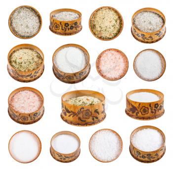collection from wooden salt cellar with various salts isolated on white background