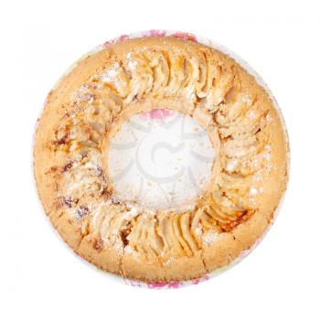 top view of torus-shaped Russian Charlotte apple cake on plate isolated on white background