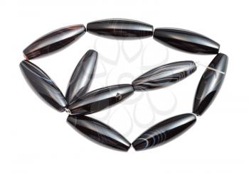 tangled string from striped black polished agate beads isolated on white background