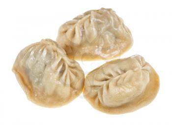 three cooked Manti (steamed dumpling stuffed with minced meat and chopped onion in central asian cuisine) isolated on white background