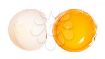 top view of separated egg yolk in shell and empty half of shell isolated on white background