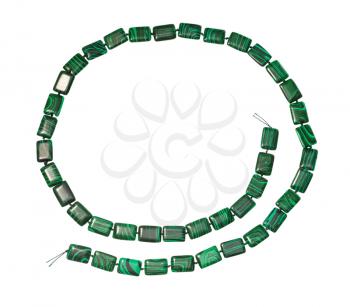 top view of string of beads from artificial malachite isolated on white background