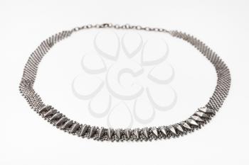 antique silver woven necklace in Art Nouveau style on white paper background