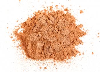 top view of handful of cocoa powder isolated on white background