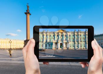 travel concept - tourist photographs of Winter Palace and Palace Square in Saint Petersburg city in Russia on smartphone in spring