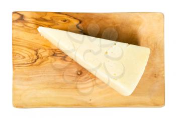 top view of piece of local italian Pecorino Romano sheep's milk cheese on olive wood cutting board isolated on white background