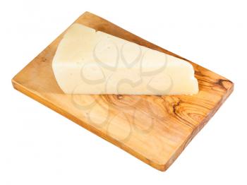 piece of local italian Pecorino Romano sheep's milk cheese on olive wood cutting board isolated on white background