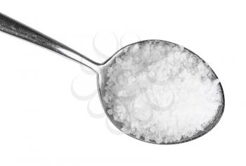 top view of tablespoon with coarse grained Sea Salt close up isolated on white background