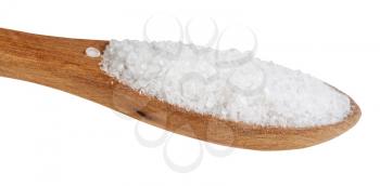 side view of wooden salt spoon with grained Rock Salt close up isolated on white background