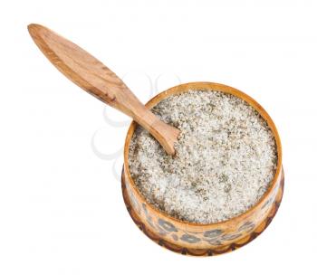wooden salt cellar with salt spoon with seasoned salt with spices and dried herbs isolated on white background