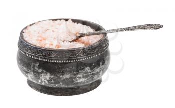 side view of old silver salt cellar with spoon with pink Himalayan Salt isolated on white background