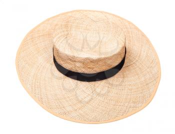 wide-brimmed straw hat with black band on crown isolated on white background