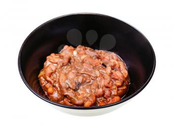 georgian cuisine - portion of lobio (spicy appetizer from stewed beans) in black bowl isolated on white background