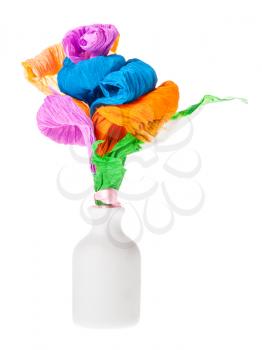 handmade artificial multicolored flowers made of crepe paper in white ceramic bottle isolated on white background