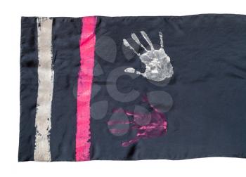 edge of handcrafted black silk scarf with handpainted handprints isolated on white background