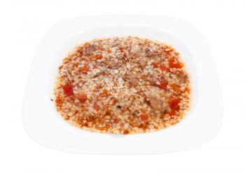 meat soup with buckwheat in white soup plate isolated on white background