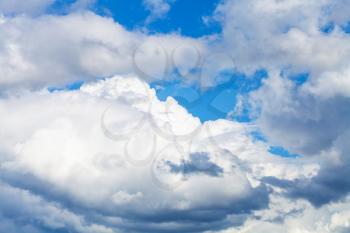large white and gray clouds in blue sky on sunny summer day