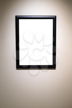 vertical narrow black picture frame with cutout canvas on gray wall