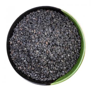 top view of black sesame seeds in round bowl isolated on white background