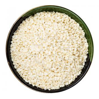 top view of white sesame seeds in round bowl isolated on white background