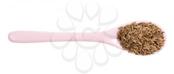 top view of ceramic spoon with caraway seeds isolated on white background