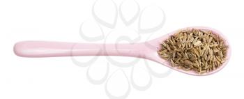 top view of ceramic spoon with cumin (cuminum cyminum) seeds isolated on white background