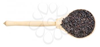 top view of raw black rice in wood spoon isolated on white background