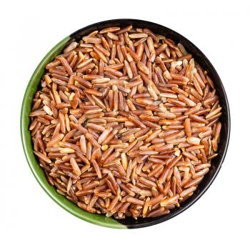 top view of raw red rice in round bowl isolated on white background