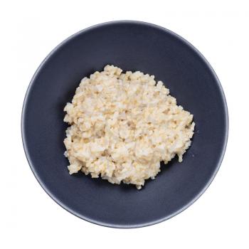 top view of porridge from brown rice in gray bowl isolated on white background