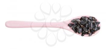 top view of ceramic spoon with black barberry fruits isolated on white background